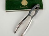 a pair of pliers sitting next to a box of matches