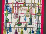 a picture of a colorful scarf with tassels on it