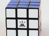 a close up of a rubik cube with a pixel face on it