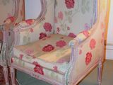 two chairs that are sitting next to each other in a room
