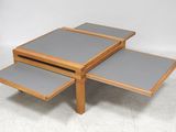 three tables with grey tops and a wooden base