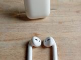 two airpods sitting next to each other on a table
