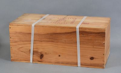 a wooden box with a white ribbon around it
