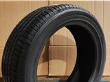 tire on the ground in front of a cardboard box