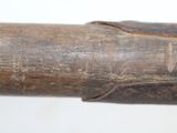 a close up of a baseball bat with a wooden handle