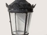 a black lamp with a crown on top of it