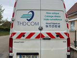 a van that is parked on the side of the road