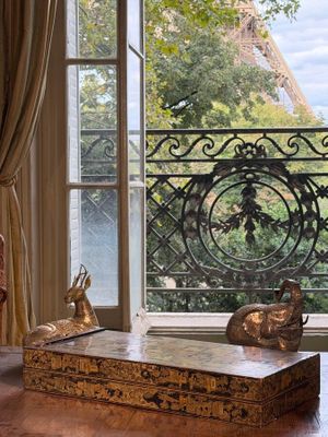 an image of a living room with a view of the eiffel tower