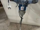 an image of a drill in a room with a white counter