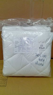 a close up of a bag of white pillows on a table