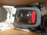 a box with a vacuum cleaner and other items in it