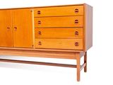 an image of a wooden cabinet with drawers and drawers on it