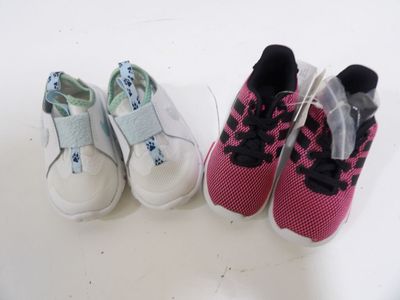 two pairs of shoes sitting next to each other on a table