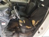 an image of a car with the door open and the seats down