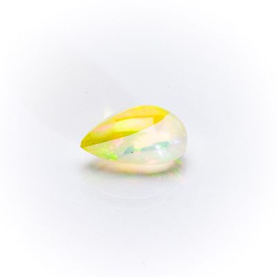 a close up of a white oplite stone with a yellow center
