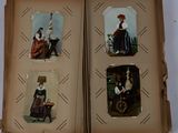 an open book with pictures of women in historical dress on it