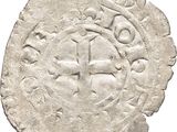 Gros plan sur une pièce de monnaie portant une croix