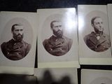 several old black and white photos of men in military uniforms