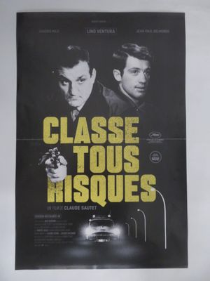 une affiche de film représentant deux hommes armés devant une voiture