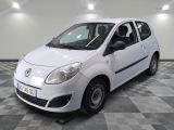 a picture of a small white car parked on a checkered floor