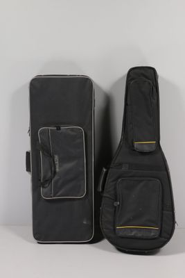 a guitar case and a guitar bag sitting on a table