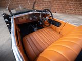 an old car with a leather seat and steering wheel