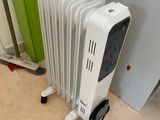 a white radiator sitting next to a green radiator