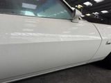 a white car that is parked in a garage