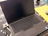 a laptop computer sitting on a desk with a mouse on it
