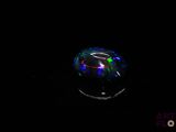an image of a glass ball in the dark