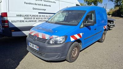 a blue van that is parked next to a white van