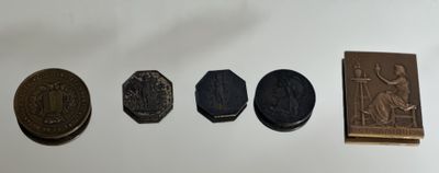 four different types of coins on a white surface