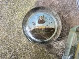 a plate with a picture of jesus on it on the ground