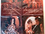 Quatre livres de la série sur les vampires sont posés sur une table