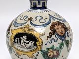 a vase that has a picture of a woman on it