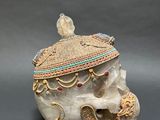 a close up of a skull with a hat on it ' s head