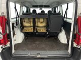 four seats in the back of a van with the doors open