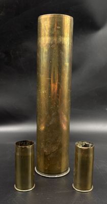 three brass vases sitting next to each other on a table