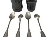 five spoons and two cups sitting next to each other