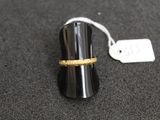 a ring that is sitting on top of a black object