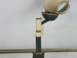 a lamp that is sitting on a table next to a wall