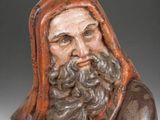 a close up of a figurine of a man with a beard