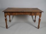 an old wooden desk with two drawers and a drawer underneath it
