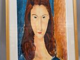 an image of a painting of a woman ' s face in a gold frame