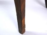 a close up view of the legs of a wooden table