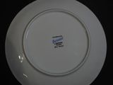a white plate with a blue and white design on it