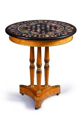an image of a round table with a mosaic top