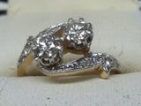 an image of a close up of a diamond ring on a white cloth