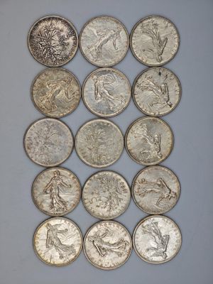 a close up of a bunch of coins sitting on top of a table