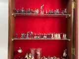 a display case with a lot of toy soldiers in it